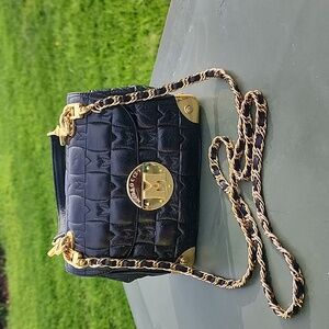 METROCITY Black Embossed Logo Quilted Leather Mini Bag